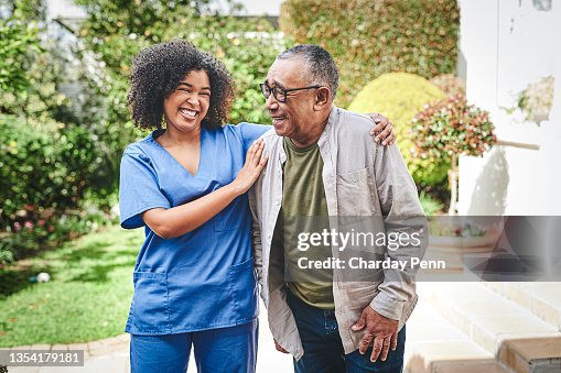 Shot of an attractive young nurse bonding with her senior patient outside Shot of an attractive young nurse bonding with her senior patient outside
