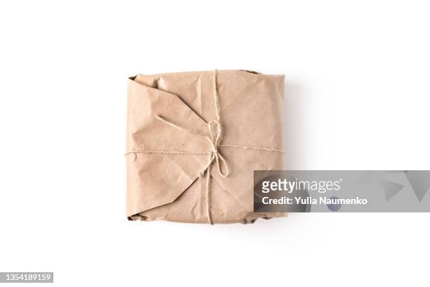 christmas gift in craft packaging - brown paper isolated stock pictures, royalty-free photos & images