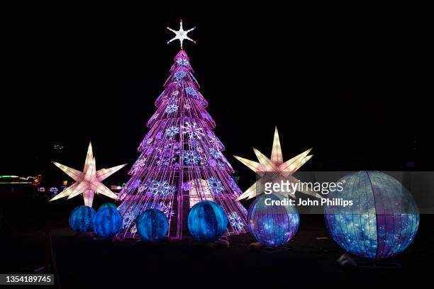 Luminous Christmas tree and decorations during the launch night of Lightopia London 2021 at Crystal Palace Park on November 18, 2021 in London,...