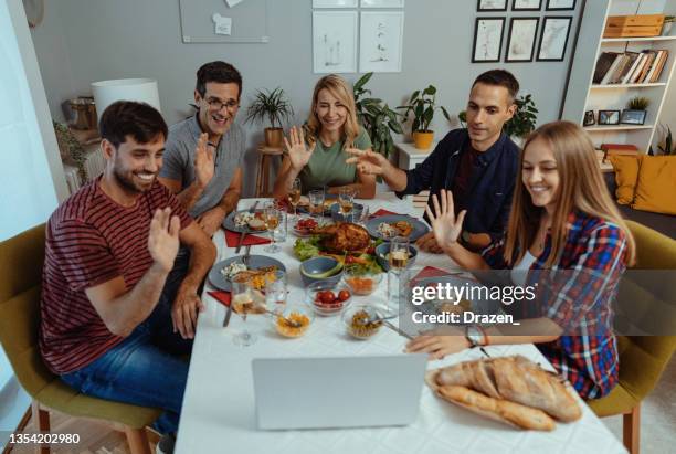 friends celebrate new year together and talking to friends and family over video call - virtual lunch stock pictures, royalty-free photos & images