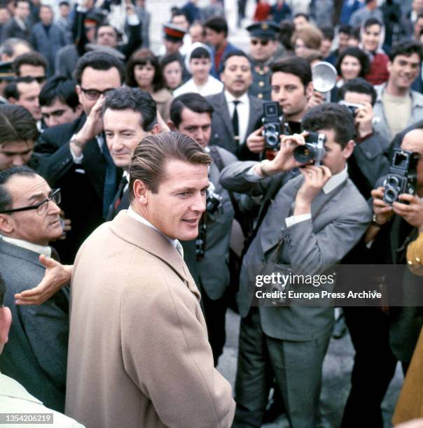 Actor Roger Moore is greeted by press and fans at Madrid's Barajas airport during one of his visits to Spain between 1966-1967, when he filmed the...