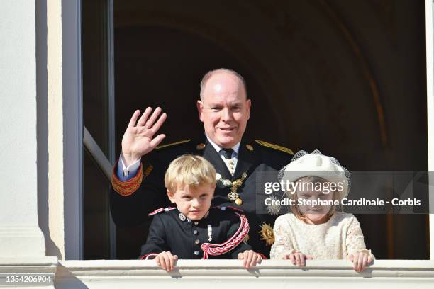 Prince Albert II of Monaco with his children Princess Gabriella of Monaco and Prince Jacques of Monaco appear at the Palace balcony during the Monaco...