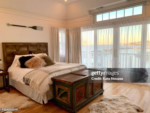 beautiful bedroom - sheepskin boot stock-fotos und bilder