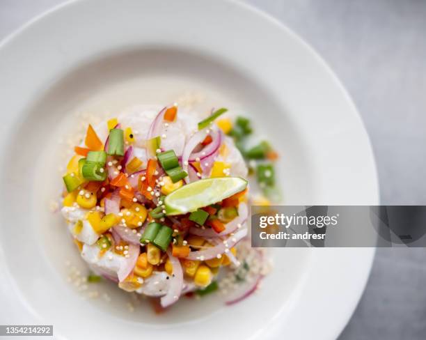 plate of ceviche served at a restaurant - ceviche bildbanksfoton och bilder