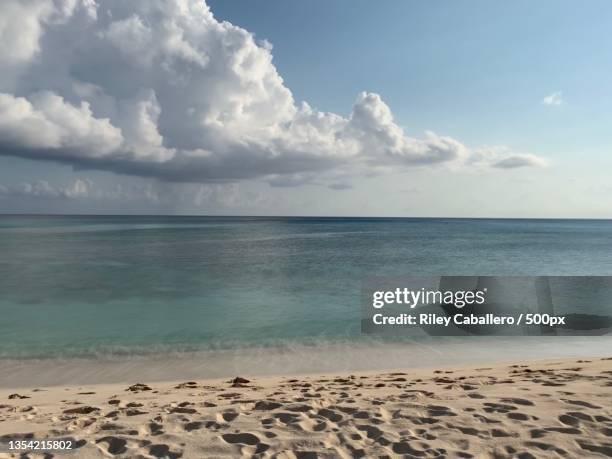 scenic view of sea against sky,cayman islands - caballero stock pictures, royalty-free photos & images