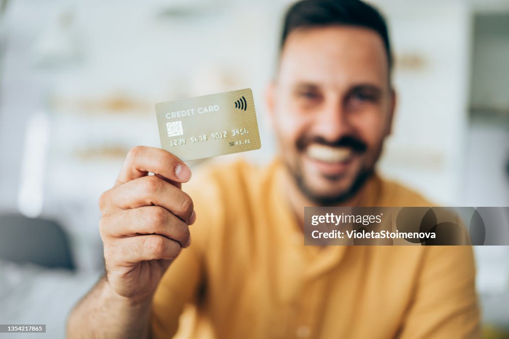 Man holding a credit card.
