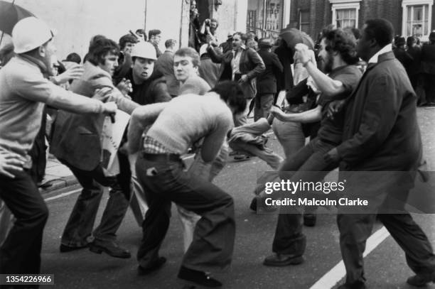 Socialist Workers Party counter-protestors and of other anti-fascist organisations clash with demonstrators of the National Front, far-right fascist...