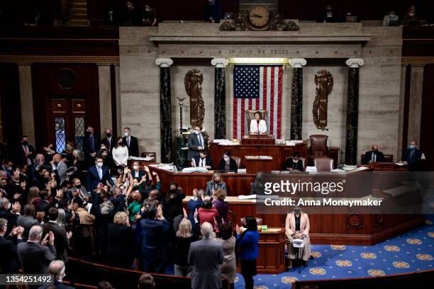 Speaker of the House Nancy Pelosi looks on as House Democrats react to the passage of the Build Back Better Act at the U.S. Capitol on November 19,...