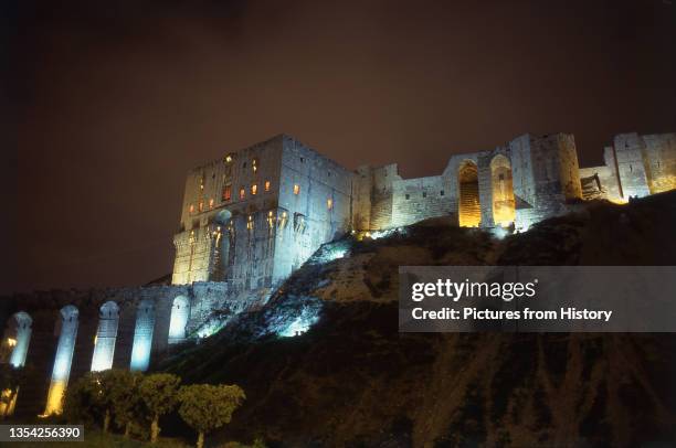 The Citadel of Aleppo is a large medieval fortified palace in the centre of the old city of Aleppo, northern Syria. It is considered to be one of the...