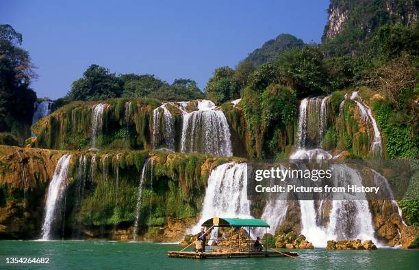 Ban Gioc Detian Falls are 2 waterfalls on the Quay Son River or Guichun River straddling the Sino-Vietnamese border, located in the Karst hills of...
