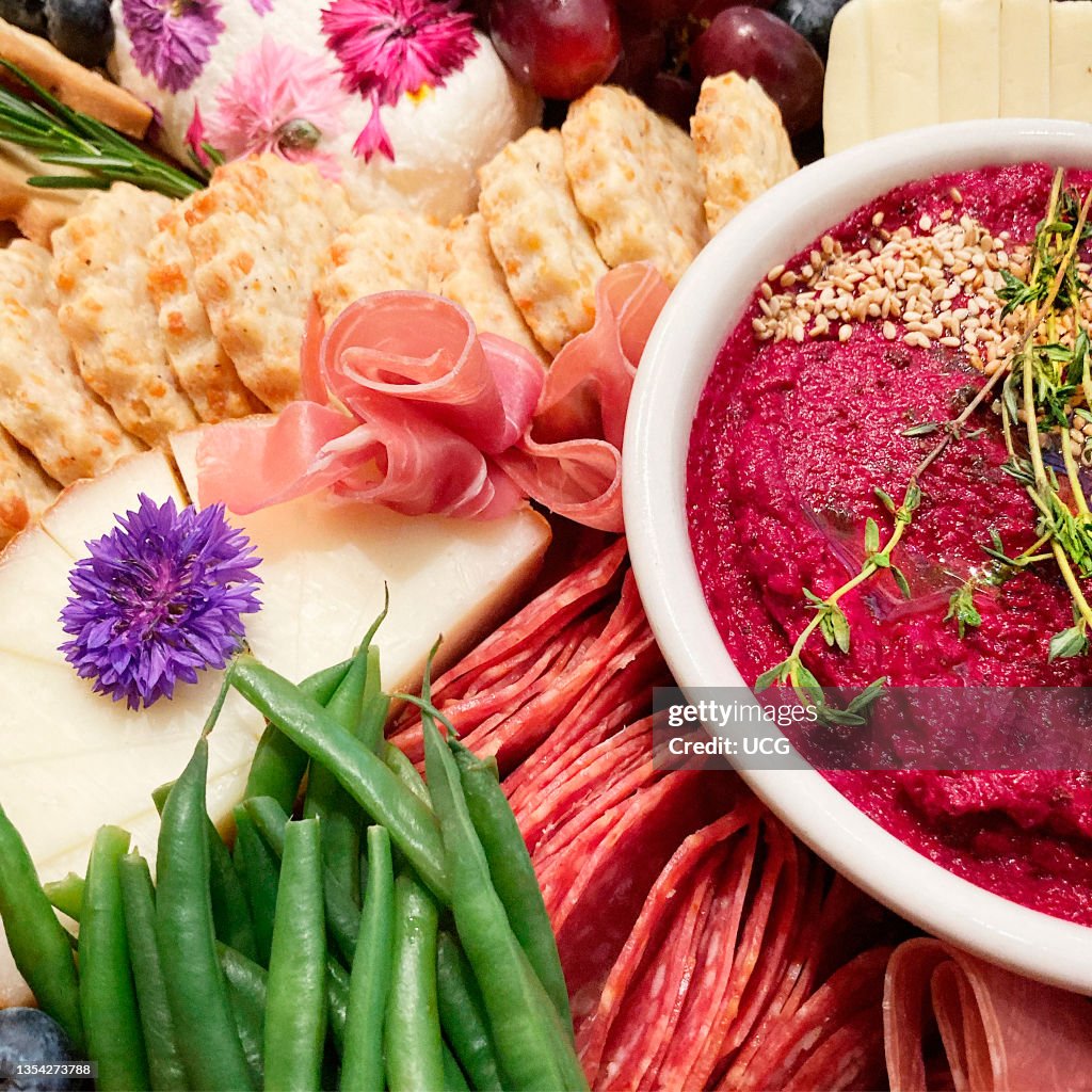 Grazing Board with Vegetables, Meat Cheese and Beet Hummus