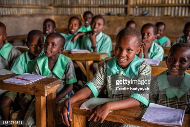 school children in a school near masai mara game reserve in kenya - native african girls stock pictures, royalty-free photos & images