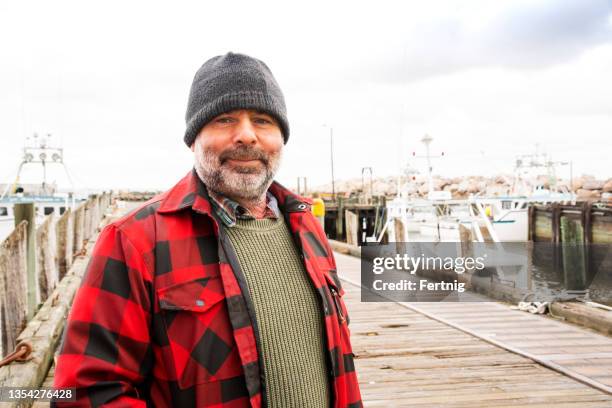 a commercial fisherman on wharf - fishing boats stock pictures, royalty-free photos & images