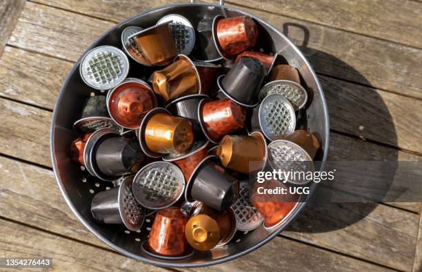 England, UK, Used coffee capsules ready for the aluminum tops to be recycled.