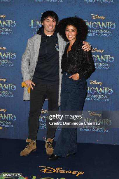 Lucas Delcourt and Aurelie Konate attend the "Encanto" - Paris Gala Screening at Le Grand Rex on November 19, 2021 in Paris, France.