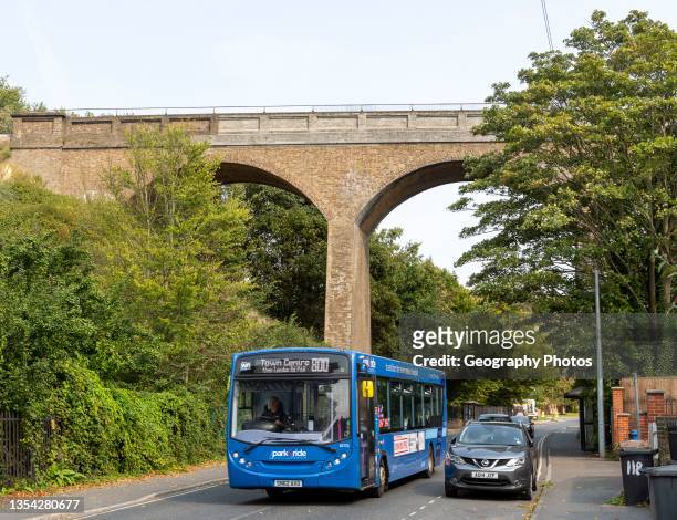 Park and Ride bus beneath railway viaduct built 1876, Spring Road, Ipswich, Suffolk, England, UK.