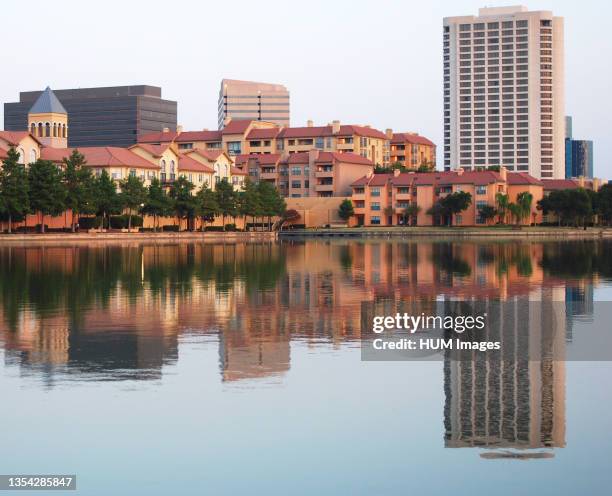 Buidlings along Lake Carolyn in the Las Colinas area of Irving, Texas. The area has seen massive building, and the lake has been made smaller since...