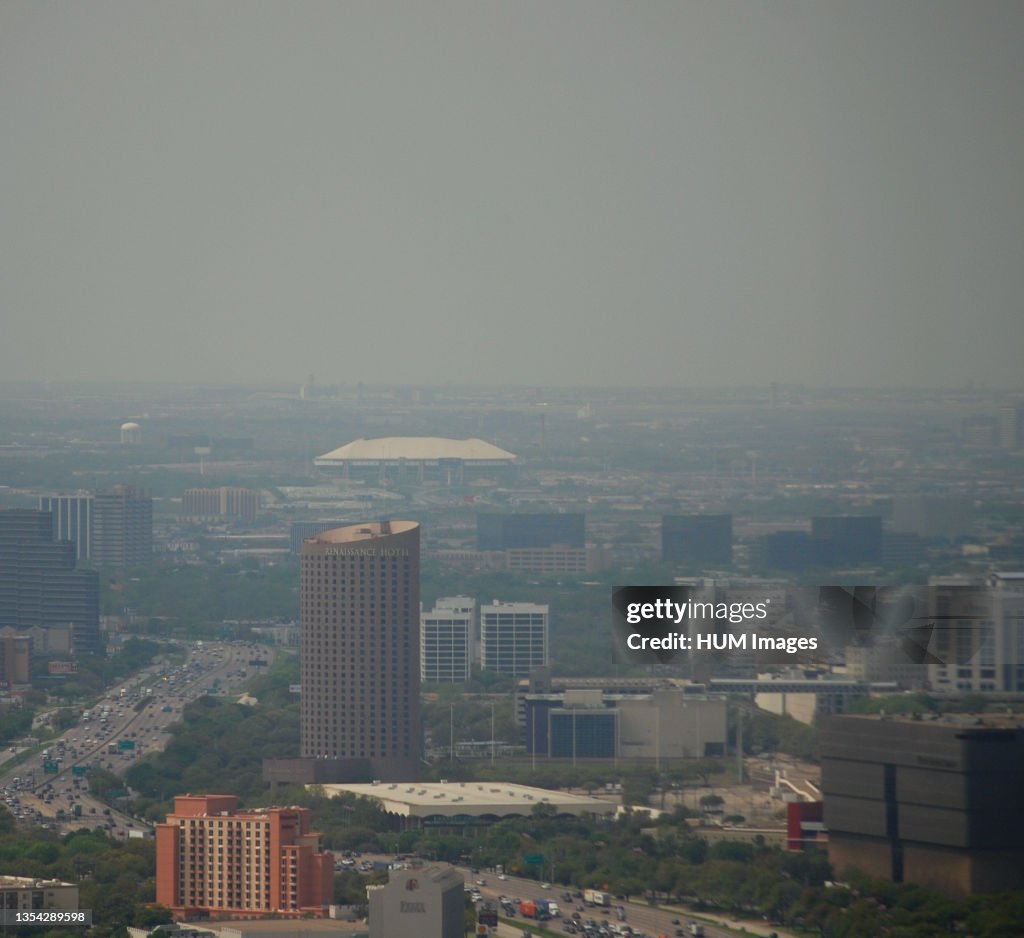 Aerial view of Dallas Texas on a smoggy day, looking north from downtown office building (Texas Stadium seen in the distance)