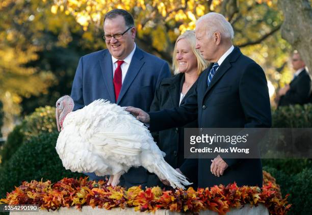 President Joe Biden pardons Peanut Butter the turkey during the 74th annual Thanksgiving turkey pardoning in the Rose Garden of the White House on...