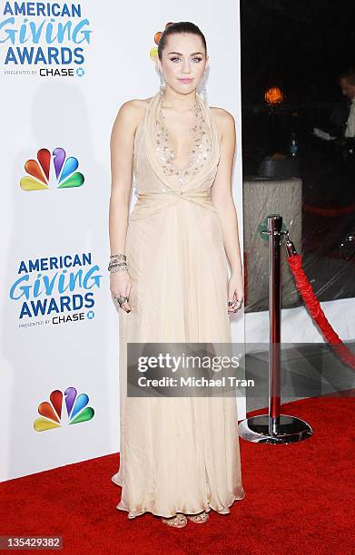 Miley Cyrus arrives at the 2011 American Giving Awards held at Dorothy Chandler Pavilion on December 9, 2011 in Los Angeles, California.