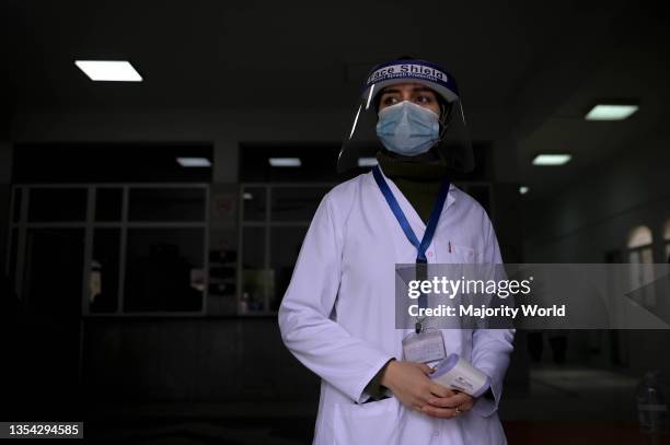 Nurse with mask and face shield. Egyptian citizens receive vaccines against Covid19 at a family health center in Alexandria, Egypt.