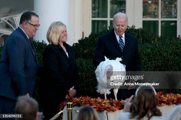 President Joe Biden pardons Peanut Butter the turkey during the 74th annual Thanksgiving turkey pardoning in the Rose Garden of the White House on...