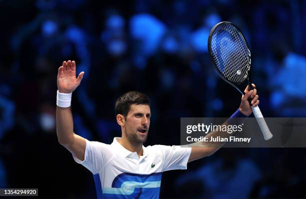 Novak Djokovic of Serbia acknowledges the crowd as he celebrates match point during his Round Robin Singles match against Cameron Norrie of Great...