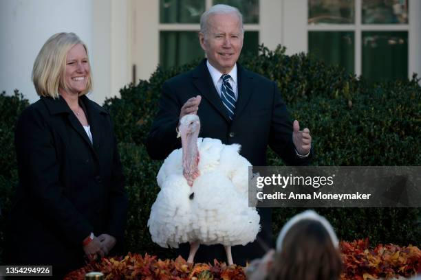 President Joe Biden pardons Peanut Butter the turkey during the 74th annual Thanksgiving turkey pardoning in the Rose Garden of the White House on...