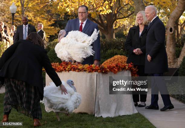 Accompanied by Chairman of National Turkey Federation Phil Seger and turkey grower Andrea Welp , U.S. President Joe Biden participates in the 74th...