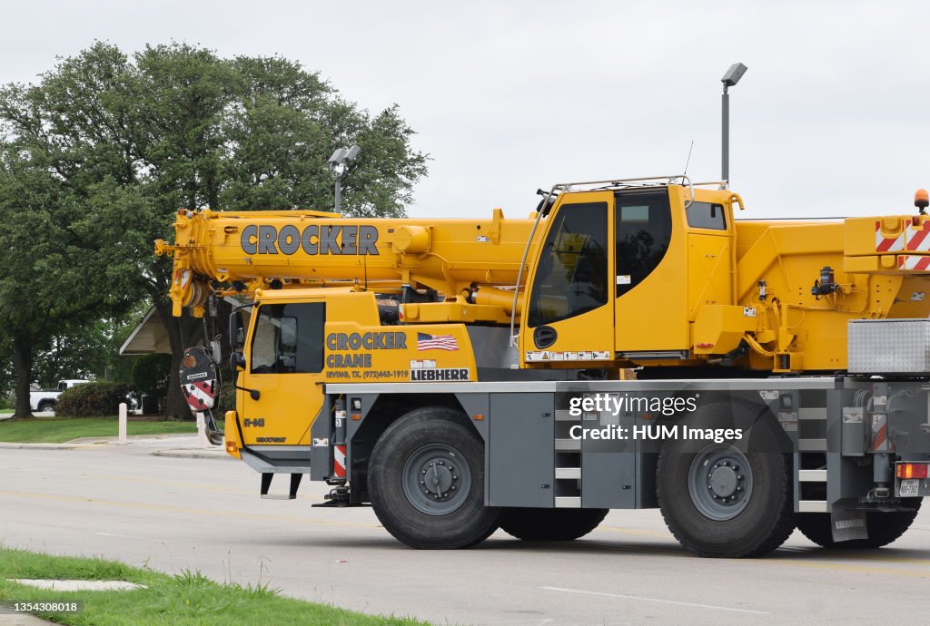 A Liebherr brand mobile crane driving on Story Rd. from Crocker Crane / RCD Equipment in Irving, TX