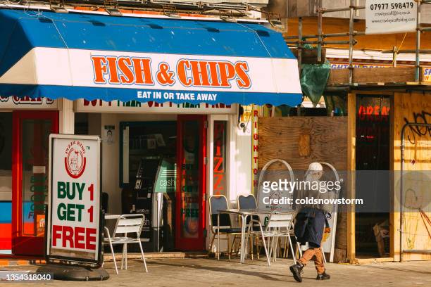 exterior of fish and chips restaurant at english seaside - fish and chips stock pictures, royalty-free photos & images