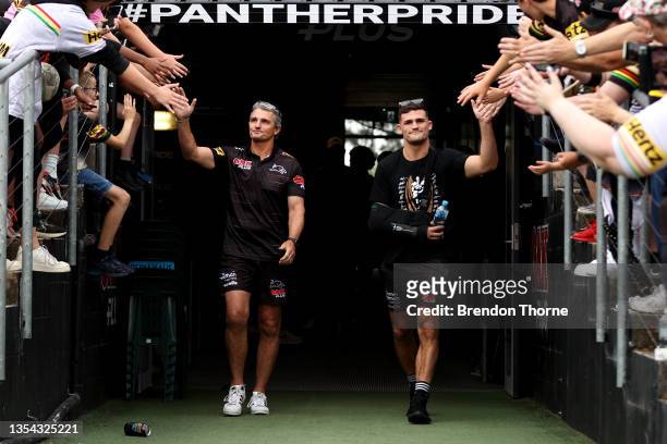 Panthers coach Ivan Cleary and Nathan Cleary of the Panthers greet fans as they walk onto BlueBet Stadium during the Penrith Panthers Grand Final...