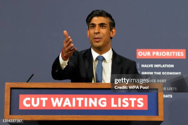 Prime Minister Rishi Sunak gestures while speaking at a press conference at No 9 Downing Street about the British National Health Service, and a 15...