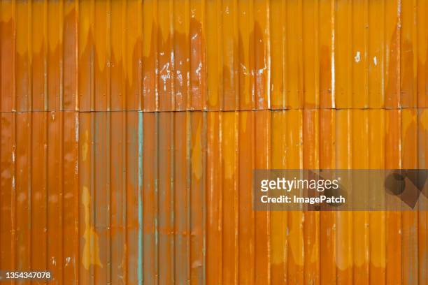 abstract orange corrugated iron wall - corrugated metal 個照片及圖片檔