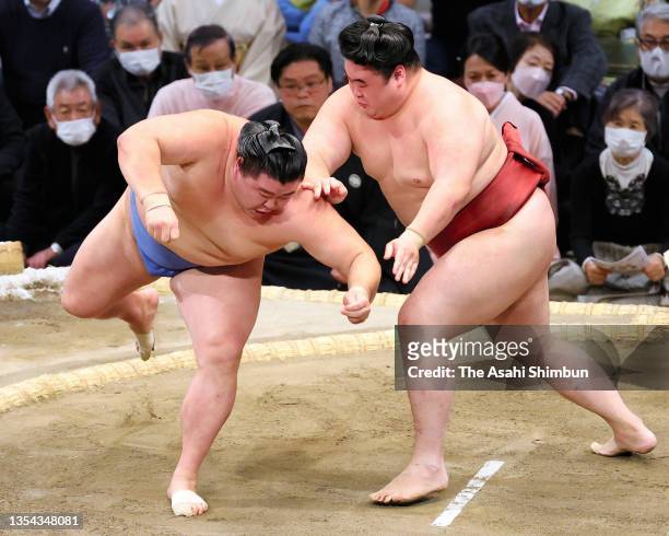 Takanosho pushes ozeki Shodai out of the ring to win on day six of the Grand Sumo Kyushu Tournament at the Fukuoka Convention Center on November 19,...