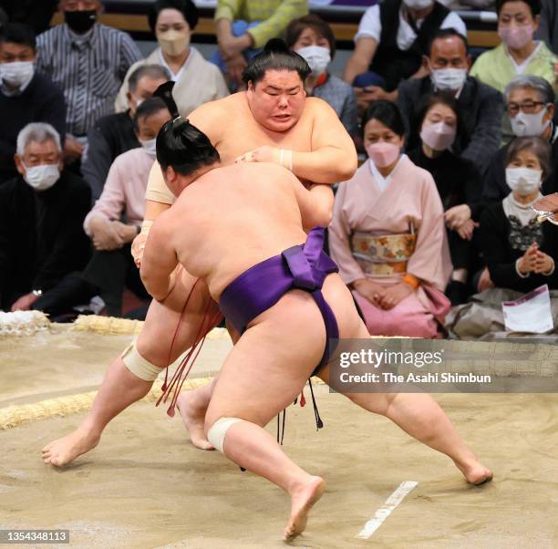 Daieisho throws sekiwake Meisei to win on day six of the Grand Sumo Kyushu Tournament at the Fukuoka Convention Center on November 19, 2021 in...