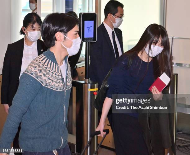 Mako Komuro and Kei Komuro are seen on departure at Haneda International Airport for New York on November 14, 2021 in Tokyo, Japan.