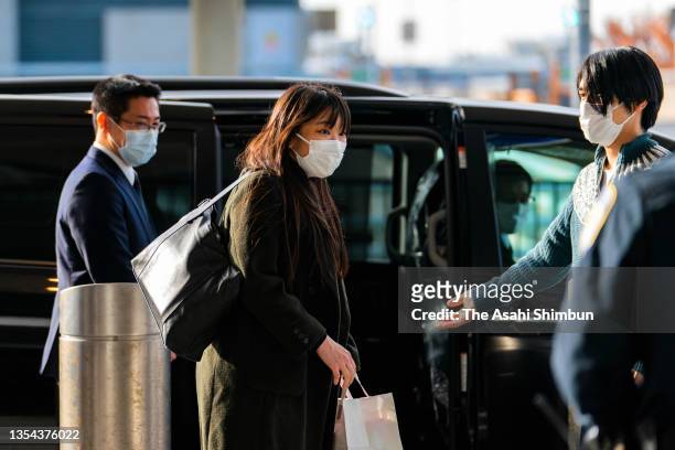 Kei Komuro and Mako Komuro are seen on arrival at John F. Kennedy International Airport on November 14, 2021 in New York City.