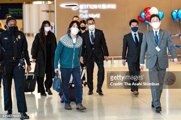 Kei Komuro and Mako Komuro are seen on arrival at John F. Kennedy International Airport on November 14, 2021 in New York City.