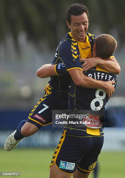 John Hutchinson and Rostyn Griffiths of the Mariners celebrate after Griffiths scored a goal during the round 10 A-League match between the Central...
