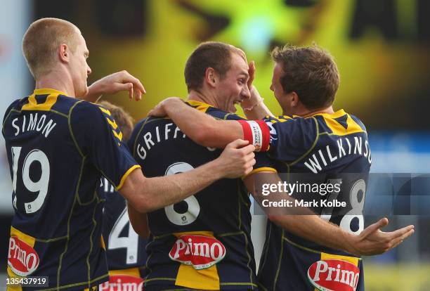 Matt Simon, Rostyn Griffiths and Alex Wilkinson of the Mariners celebrate after Griffiths scored a goal during the round 10 A-League match between...