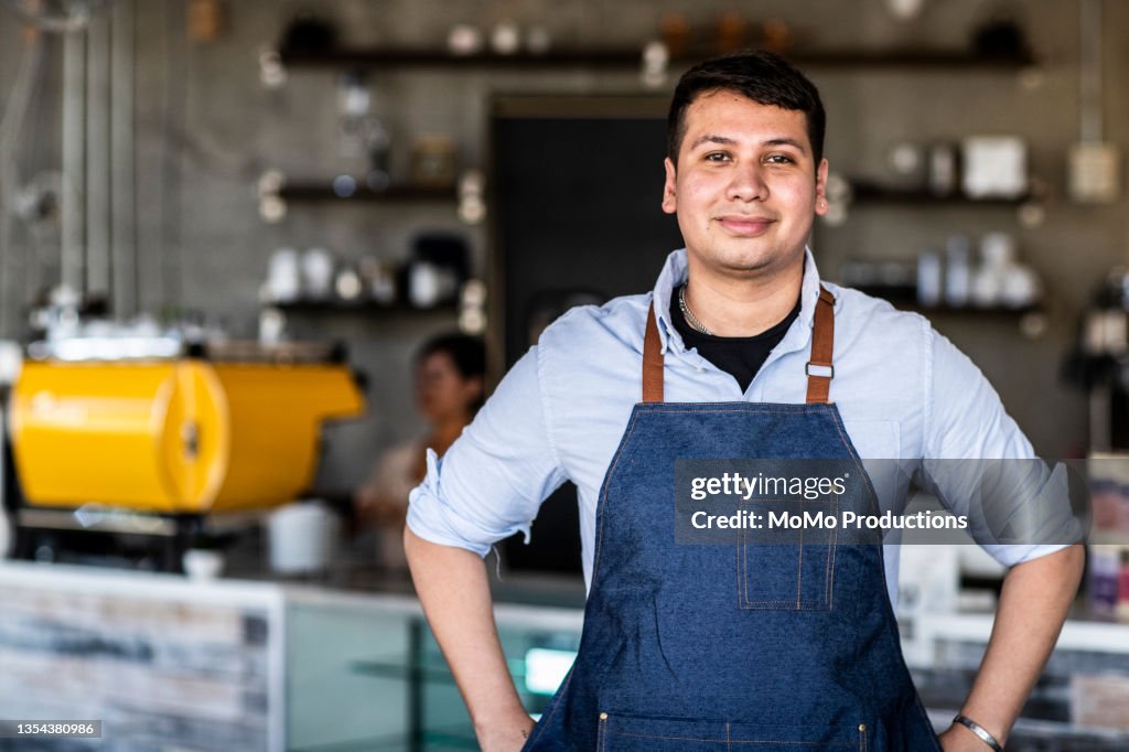 Portrait of male coffeeshop owner in coffeeshop
