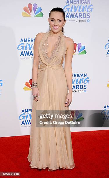 Actress/singer Miley Cyrus arrives at the American Giving Awards at Dorothy Chandler Pavilion on December 9, 2011 in Los Angeles, California.