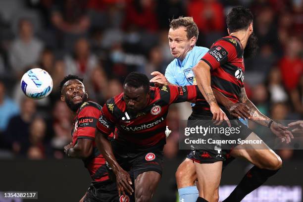 Alex Wilkinson of Sydney FC attempts a header at goal during the A-League match between Western Sydney Wanderers and Sydney FC at CommBank Stadium,...