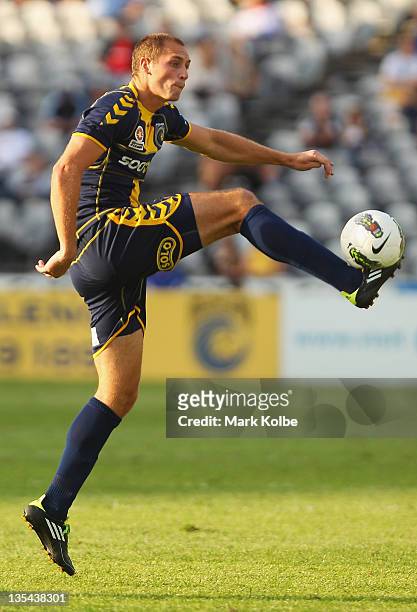 Rostyn Griffiths of the Mariners kicks during the round 10 A-League match between the Central Coast Mariners and the Newcastle Jets at Bluetongue...