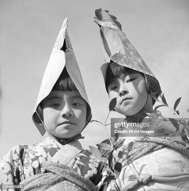 Tule Lake Relocation Center, Newell, California. Two of the Nursery School Children who pariticipated in the Harvest Festival Parade held at this...