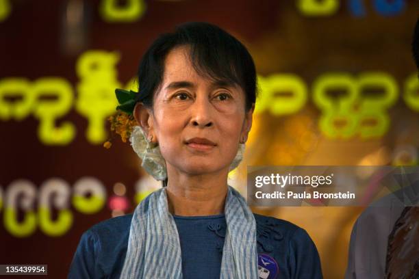 Democracy leader Aung San Suu Kyi stands along side party members for a group portrait during 20th anniversary ceremonies to honor her winning the...