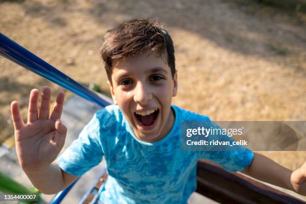 boy hiking and vlogging using mobile phone - turk telekom bildbanksfoton och bilder