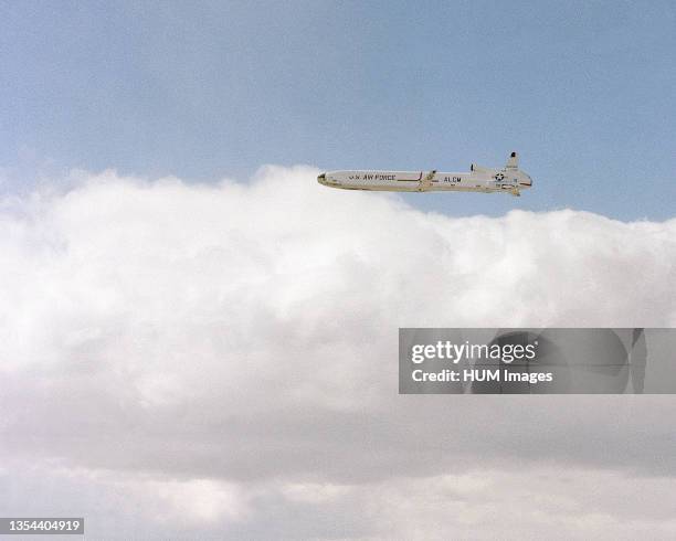 Side view of an AGM-86 air-launched cruise missile in flight after release from a B-52 Stratofortress aircraft.