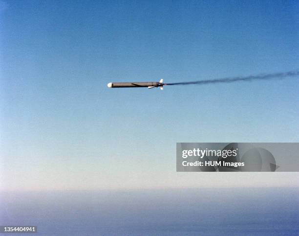 Left side view of an AGM-109 Tomahawk air-launched cruise missile in flight after release from a B-52 Stratofortress aircraft.